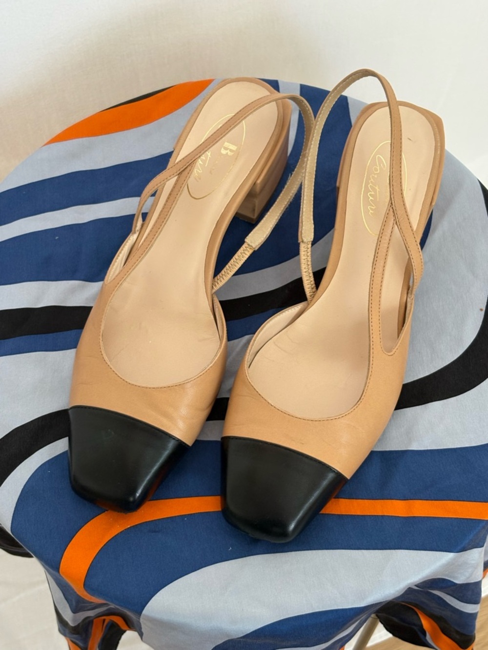 Beige and Black Leather Slingback Pumps